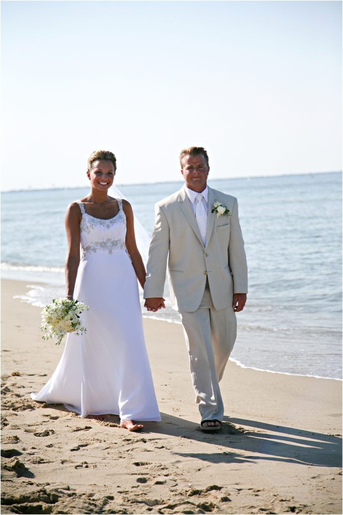 Beach wedding with tank flowers and a white suit